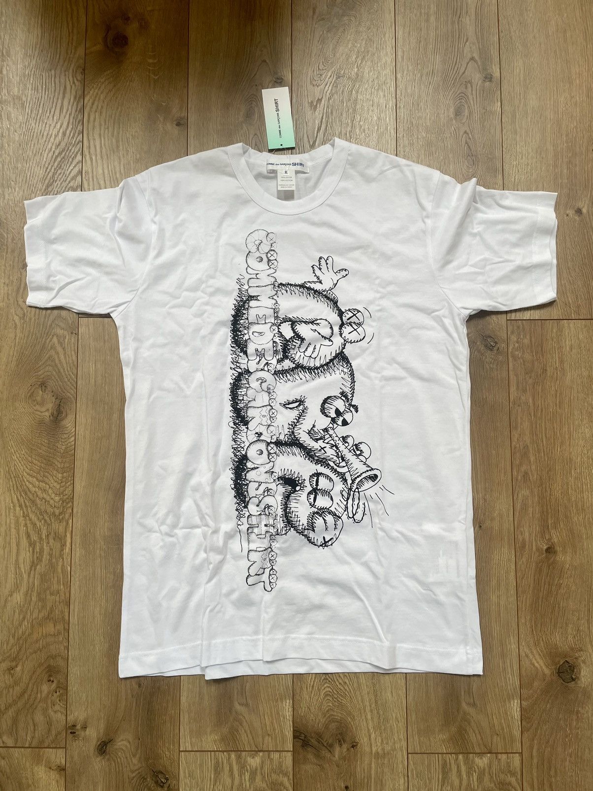 Designer X Kaws Cdg X Kaws Big Graphic Graffiti Celebration Text Logo Tee Hoodie, Sweatshirt | FlexRushtees.com