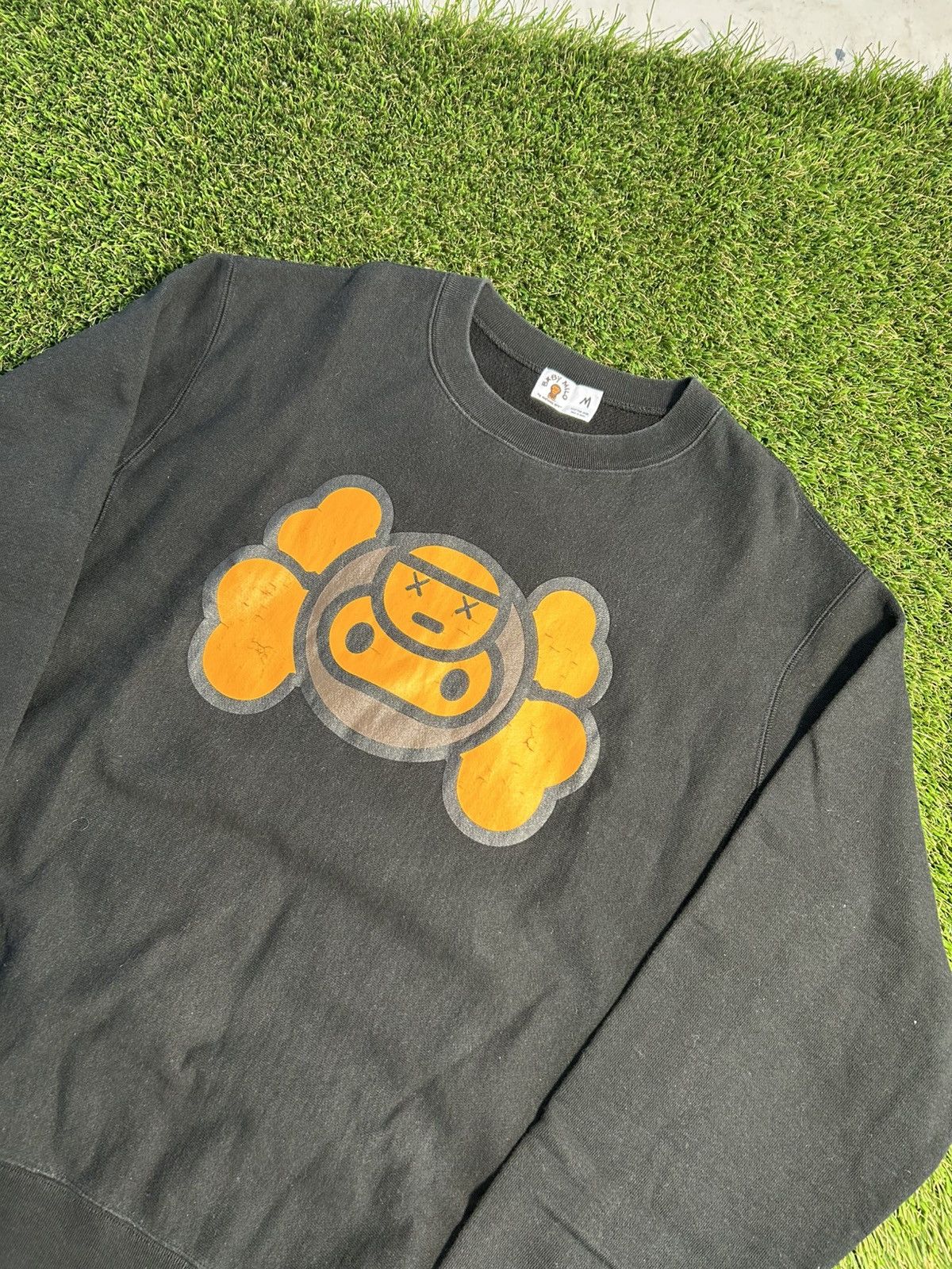 Kaws 2000 S Bape X Kaws Baby Milo Upside Down Black Sweatshirt T-Shirts, Hoodie | FlexRushtees.com