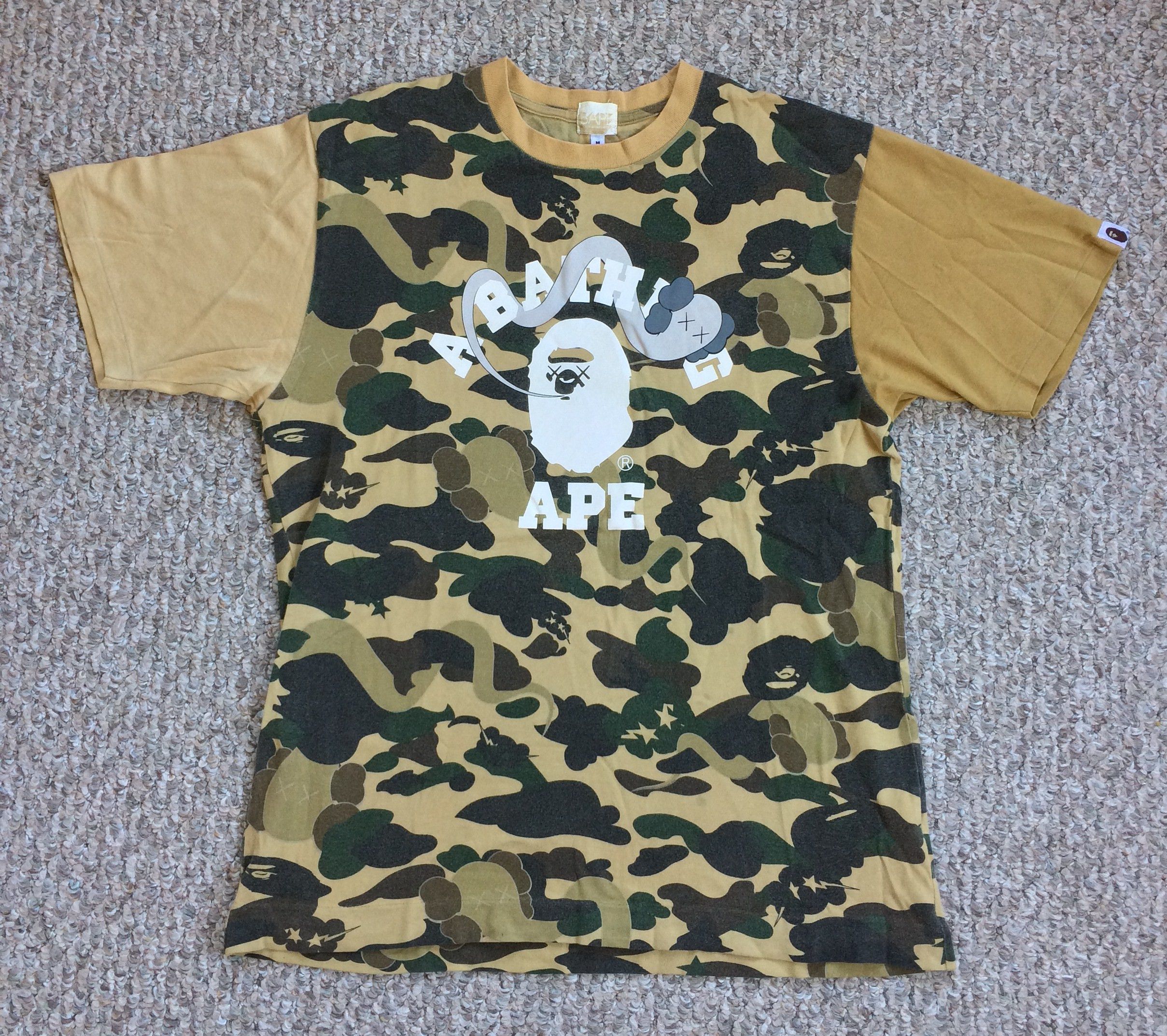 Kaws F W 2005 Bape X Kaws 1st Camo Logo Tee Hoodie, Sweatshirt | FlexRushtees.com